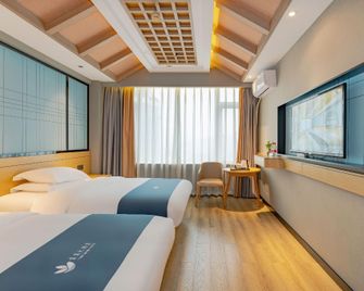 Yibin Grand Hotel - Yibin - Schlafzimmer