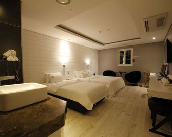 هوتل دي أوربان - سيول - غرفة نوم