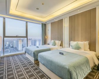 Xana Deluxe Hotel (Handan East Railway Station Meile City) - Handan - Schlafzimmer