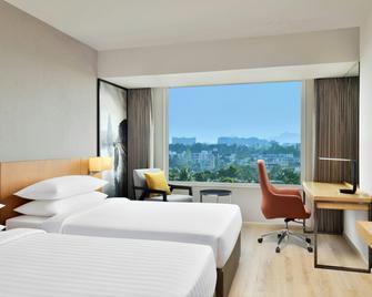 Courtyard by Marriott Nashik - Nashik - Slaapkamer