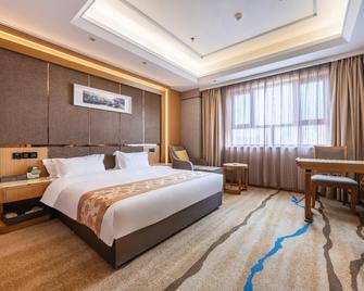 Wenzhou Hotel - Hotan - Camera da letto