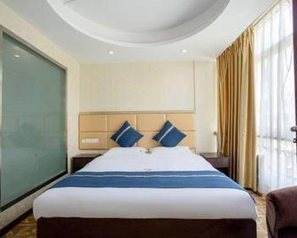 Yaohui Business Hotel - Mianyang - Camera da letto