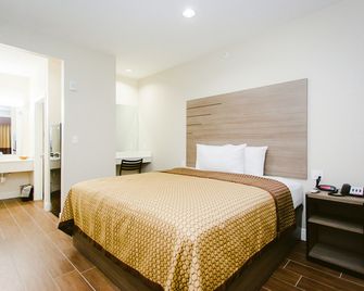 scottish inn & suites - Baytown - Habitación