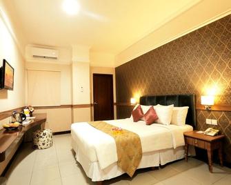 Amarelo Hotel Solo - Surakarta City - Bedroom