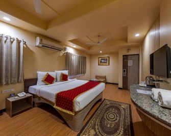 Hotel Surya International - Solāpur - Slaapkamer
