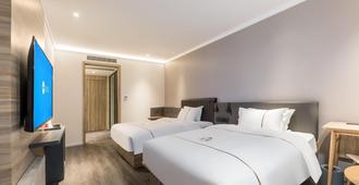 Hanting Hotel Changzhou Xinbei Wanda - ฉางโจว - ห้องนอน