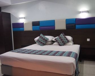 هوتل ألما - جاكرتا - غرفة نوم