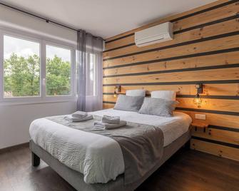 لوجي أوتل باري-مدريد - داكس - غرفة نوم