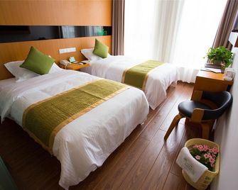 Vatica Tianjin Jinghai Bus Station Home World Plaza Hotel - Tianjin - Bedroom