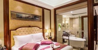 Grand Metropark Guofeng Hotel Tangshan - Tangshan - Camera da letto