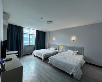 Wenle Hotel - Qianxinan - Bedroom