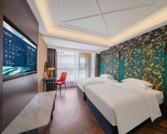 Jinjiang Metropolo Hotel Nyingchi Nanyue Avenue - Nyingchi - Schlafzimmer