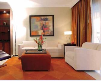 1BR Presidential Suites in Lifestyle Puerto Plata - Puerto Plata - Living room