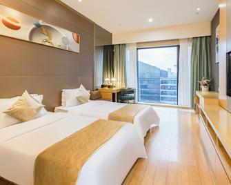 إكزينجي إنترناشونال هوتل بولي ستور - غوانغزهو - غرفة نوم