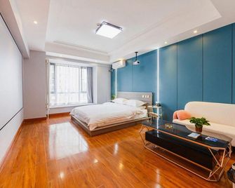 Yueshang Zhenxuan Movie Homestay (Daming Palace Wanda Plaza) - Xi'an - Bedroom