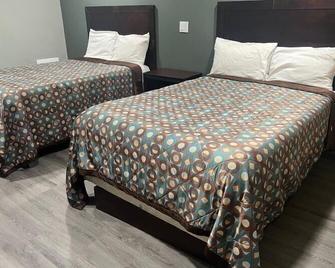 Red Carpet Inn - Garfield Heights - Slaapkamer