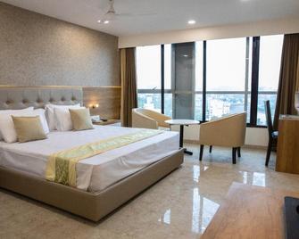 Hotel Grace Galaxy - Mumbai - Phòng ngủ