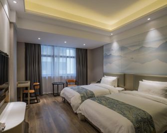 Putian Golden Bay Hotel (Wanda Plaza Branch) - Putian - Bedroom