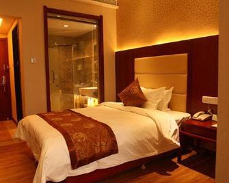 Taoyuan Hotel - Linyi - Slaapkamer