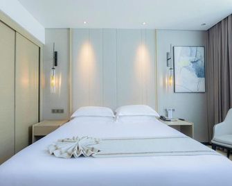 New Beacon Shanshui Hotel (Jingzhou Xintiandi) - Jingzhou - Slaapkamer