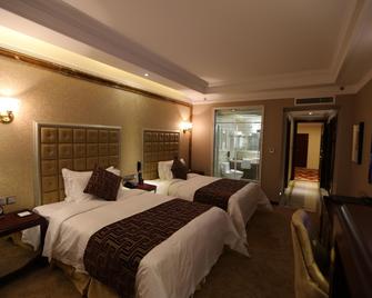 Chifeng Jiuyu Century Hotel - Chifeng - Bedroom