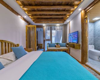 Easy Inn - Lijiang - Schlafzimmer