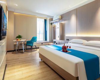 Tianjin Bindao Holiday Hotel - Tiençin - Yatak Odası