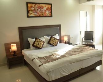 Hotel Sopan Heights - Nuova Delhi - Camera da letto