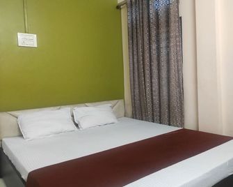 Homocation Sp Lodge - Nagaon - Bedroom