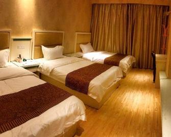 Aiqinghai Hotel - Huanggang - Habitación