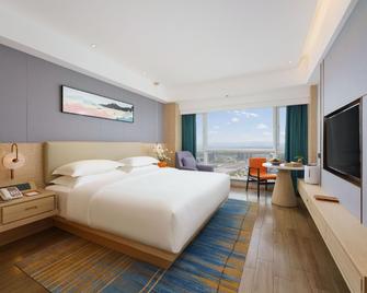 Urumqi Luolan Hotel - אורומצ'י - חדר שינה