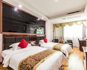 Crown Hotel (Putian Xianyou Bus Station Linan Food Street Store) - Putian - Schlafzimmer
