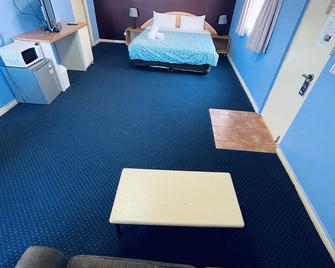 City East Motel - Melbourne - Schlafzimmer