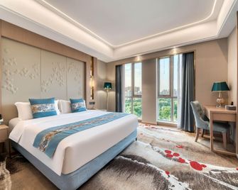 Yin Sheng International Hotel - Heze - Camera da letto