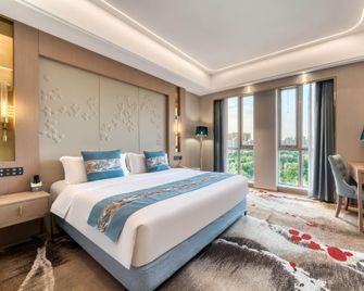Yin Sheng International Hotel - Heze - Спальня