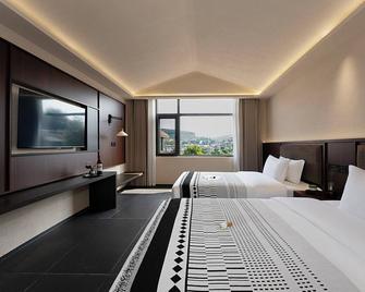 Jinghong City Chenduo Nanshan Hotel - Xishuangbanna - Slaapkamer