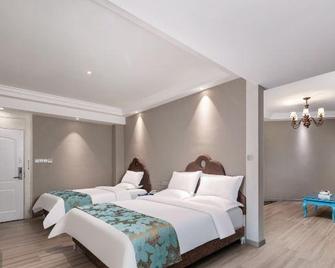 Yimi Sunshine Boutique Hotel (Xichang Qionghai Wetland Park) - Liang-šan - Ložnice