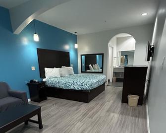 Regency Inn & Suites - Humble - Schlafzimmer