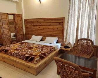 Greenwoods Inn - Dharamshala - Yatak Odası