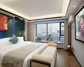 Yixi Huajian Homestay (Changsha Wu Yi Square Ifs) - Changsha - Bedroom