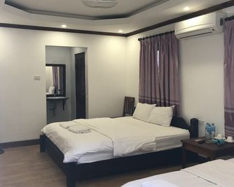 金蓮花廣場賓館 - 龍坡邦 - 臥室