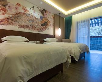Demen Renli Boutique Inn (Dayi Anren Old Town) - Chengdu - Camera da letto