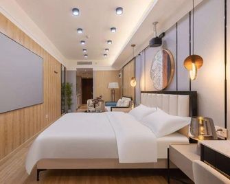 Shiyi Yaju Hotel Apartment - Jinan - Schlafzimmer