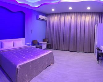 Wen Sha Bao Motel - Jiaoxi - Schlafzimmer