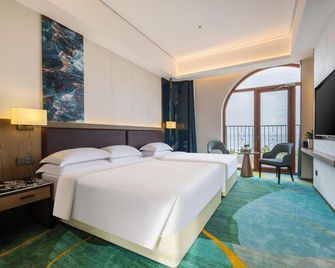 Jiulongsheng Hotel - Wej-chaj - Ložnice