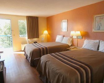 Americas Best Value Inn Tucker - Tucker - Schlafzimmer