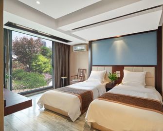 Liangyuan Sanguo Wenhua Hotel - Mianyang - Habitación