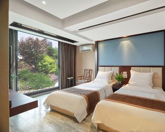 Liangyuan Sanguo Wenhua Hotel - Mianyang - Camera da letto