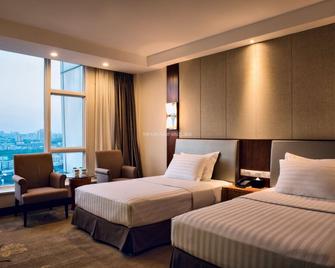 Nan Chong Universal House Hotel - Nanchong - Slaapkamer
