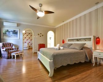 Doce Canela - Pousada de Charme - קאנלה - חדר שינה